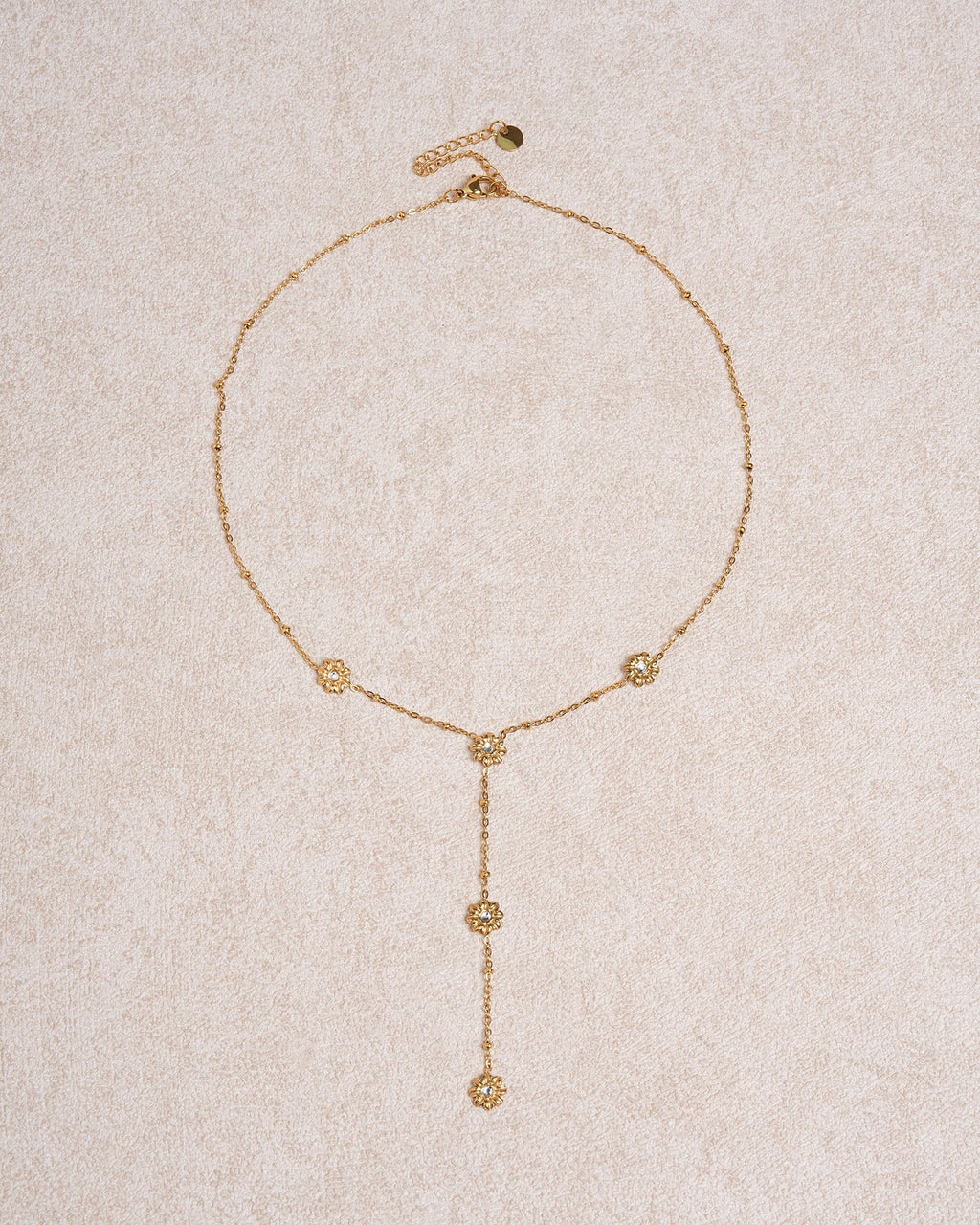 Collana dorata con zirconi a margherita da collo