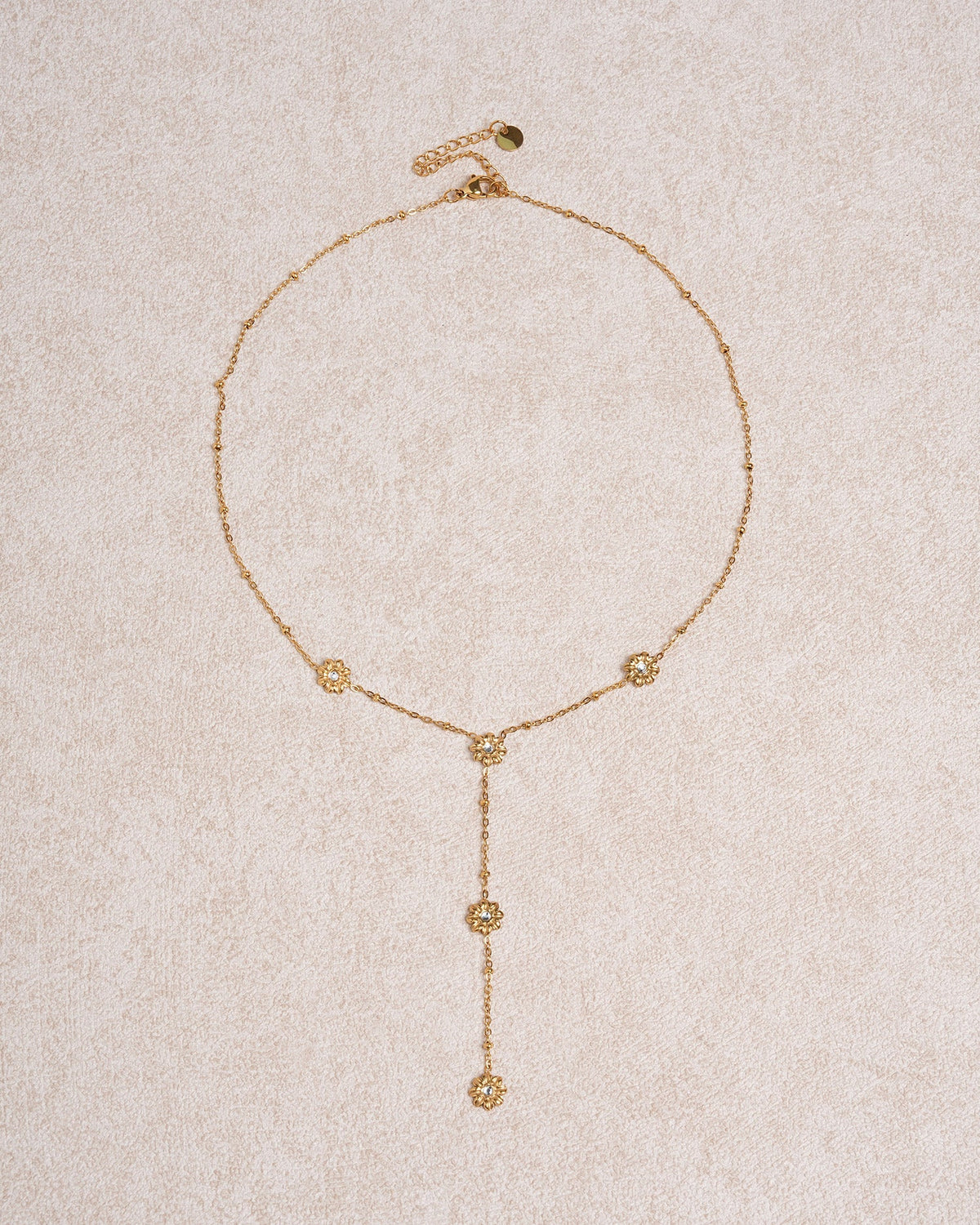 Collana dorata con zirconi a margherita da collo